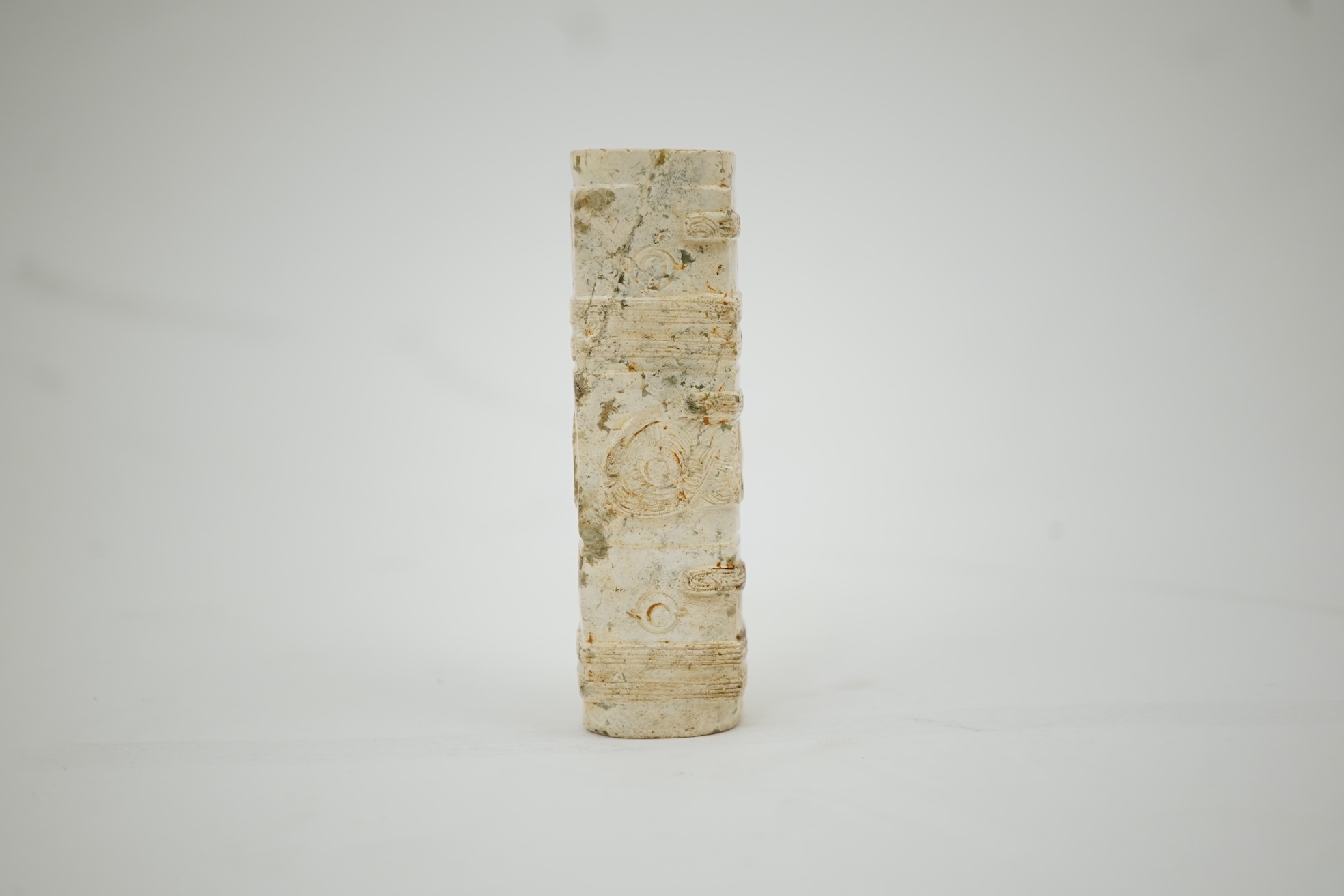 Four Chinese archaistic hardstone or burnt jade cong or cylinders